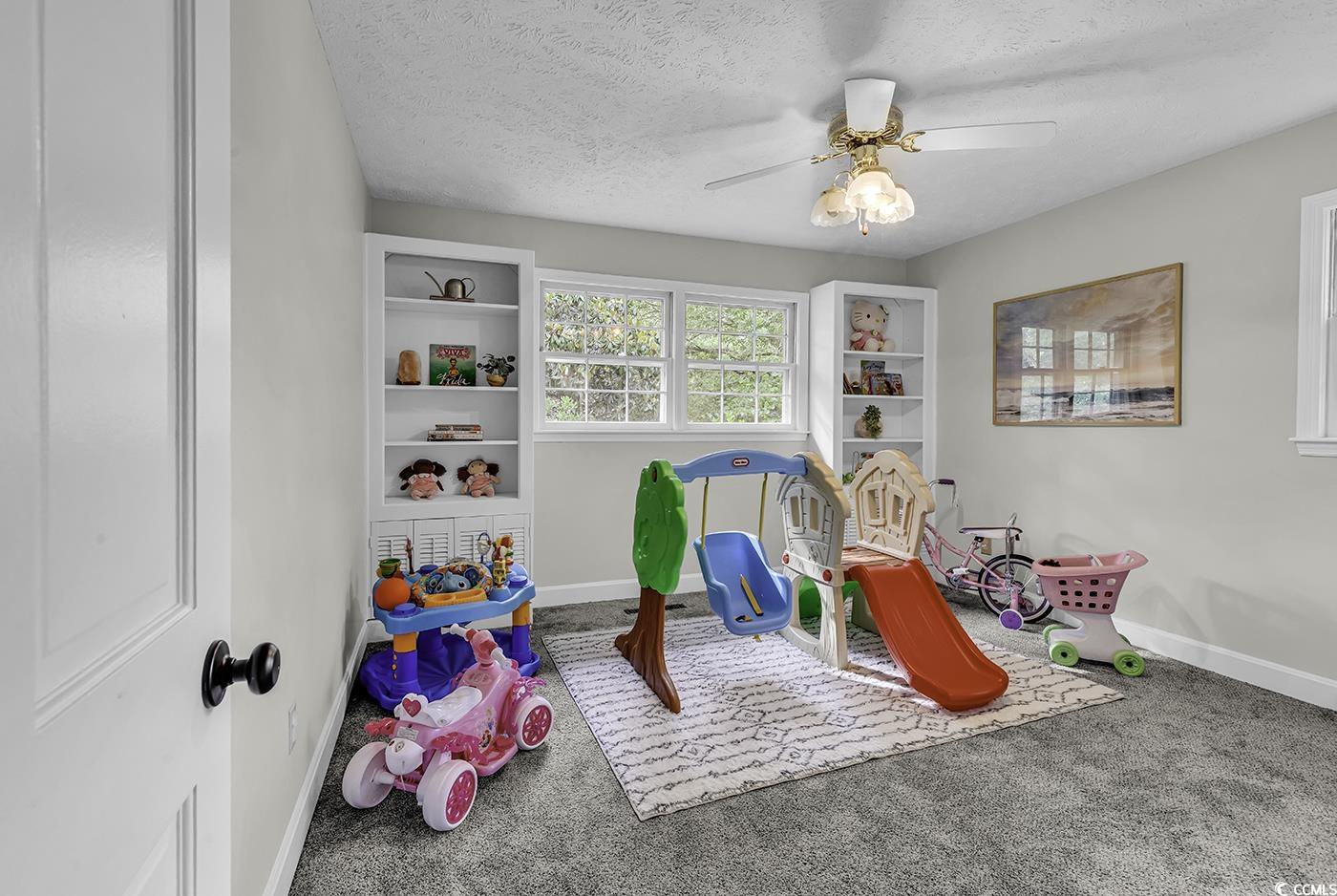 1305 Forest View Road Conway, SC 29526 - Photo 28 of 40 Recreation room featuring carpet floors, baseboards, a textured ceiling, and a ceiling fan