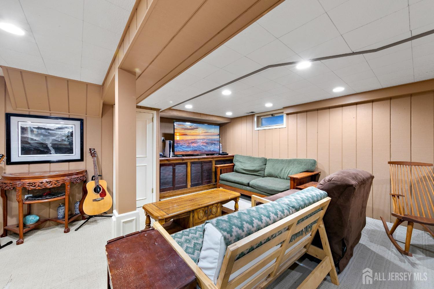 8 Beverly Drive Old Bridge, NJ 08857 - Photo 17 of 34 a living room with furniture and a flat screen tv