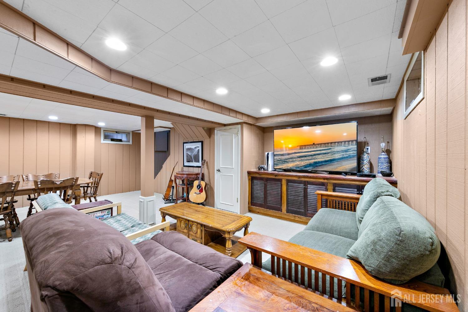 8 Beverly Drive Old Bridge, NJ 08857 - Photo 18 of 34 a living room with furniture and a flat screen tv