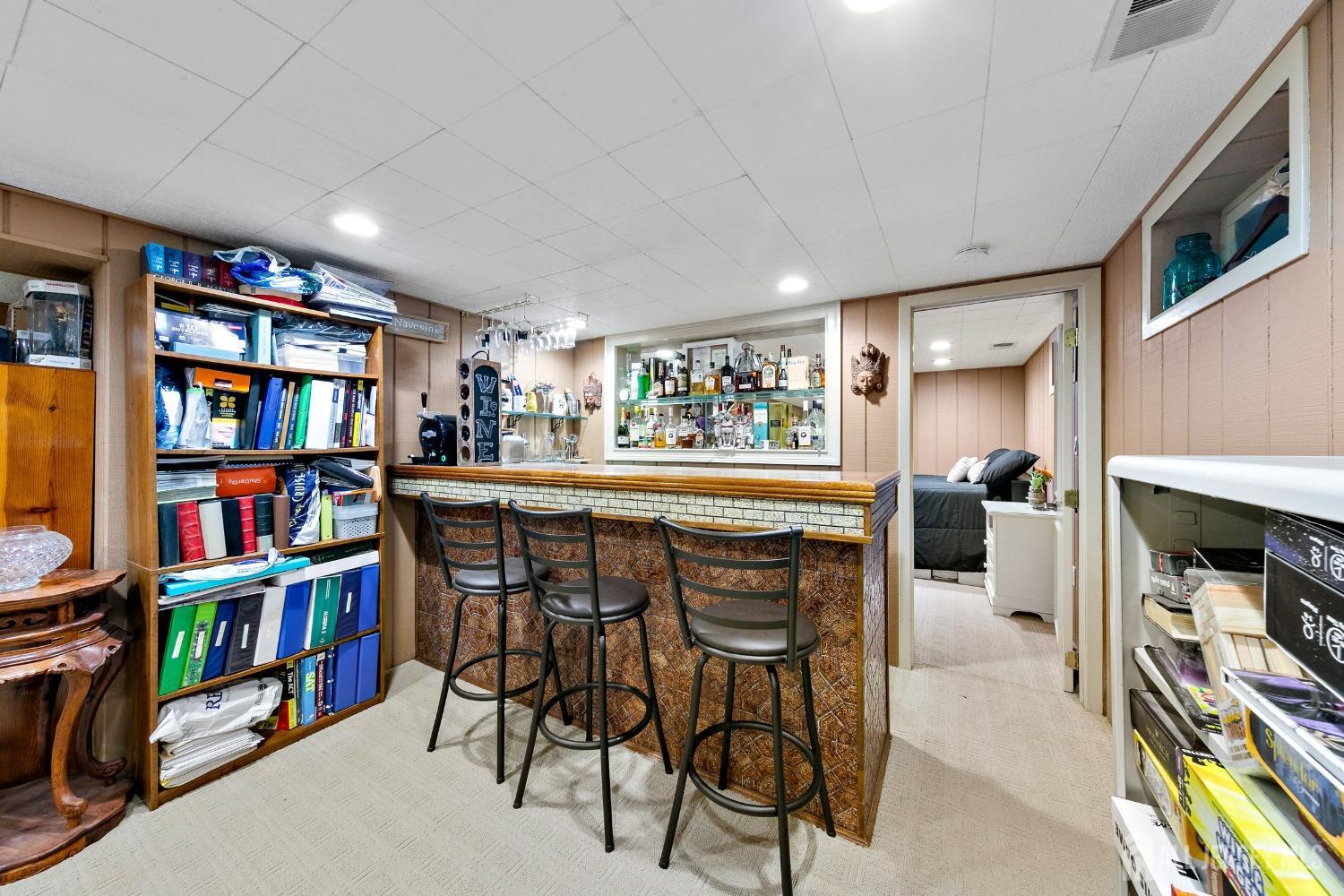 8 Beverly Drive Old Bridge, NJ 08857 - Photo 21 of 34 a dining room with furniture and a book shelf