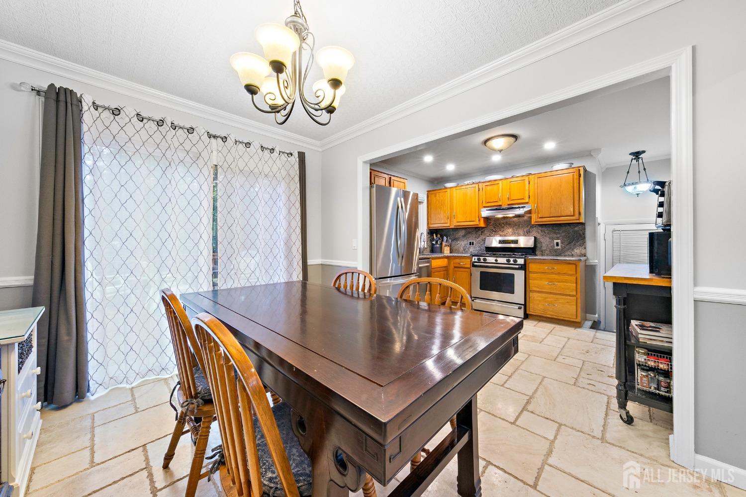 8 Beverly Drive Old Bridge, NJ 08857 - Photo 6 of 34 a dining room with furniture and wooden floor