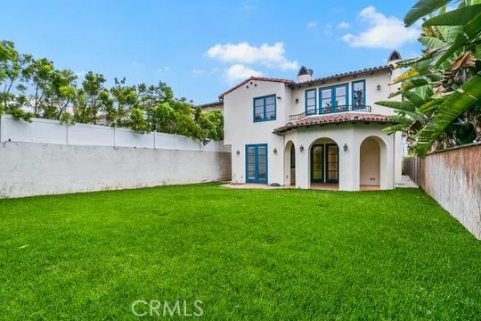 a view of a house with a yard and a garden