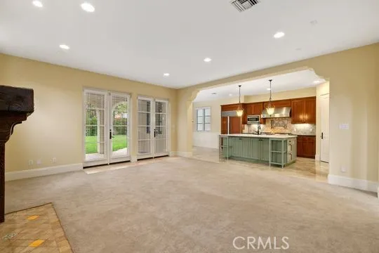 a view of a kitchen with a sink and a window