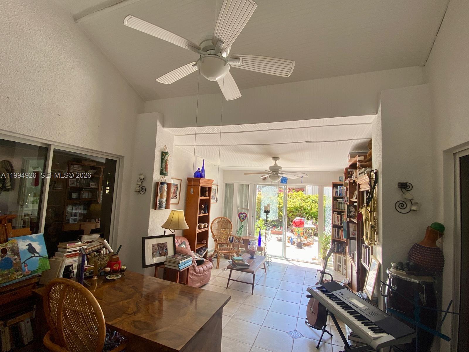 656 Northwest 129th Place Miami, FL 33182 - Photo 18 of 36 a living room with lots of furniture and chandelier