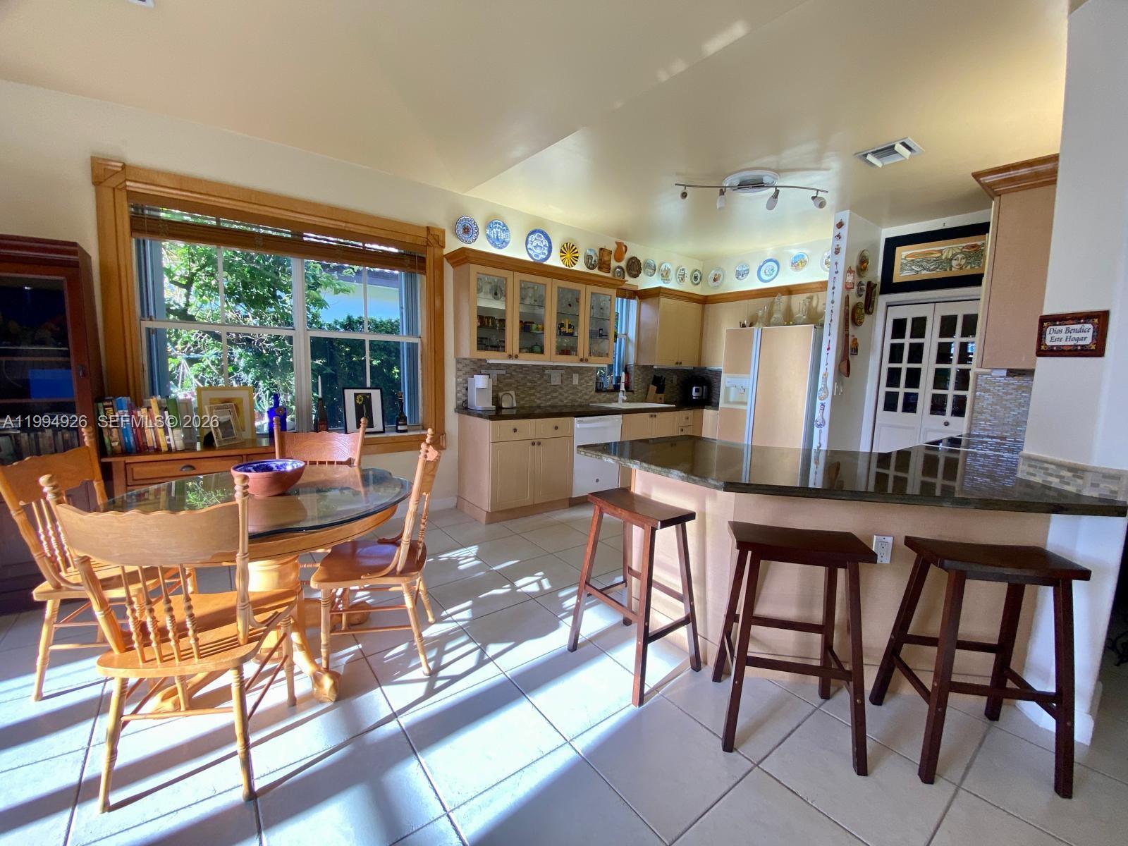 656 Northwest 129th Place Miami, FL 33182 - Photo 25 of 36 a view of a dining room with furniture window and outside view