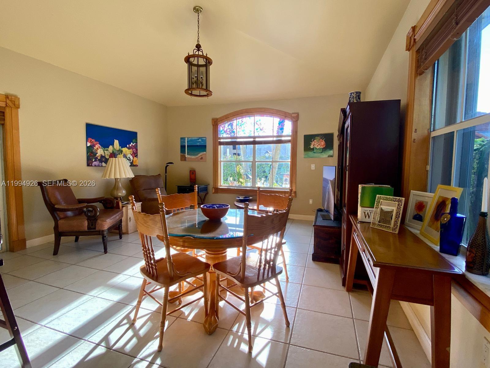 656 Northwest 129th Place Miami, FL 33182 - Photo 26 of 36 a view of a dining room with furniture window and outside view