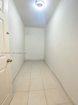 656 Northwest 129th Place Miami, FL 33182 - Photo 29 of 36 a view of a room with racks on the wall