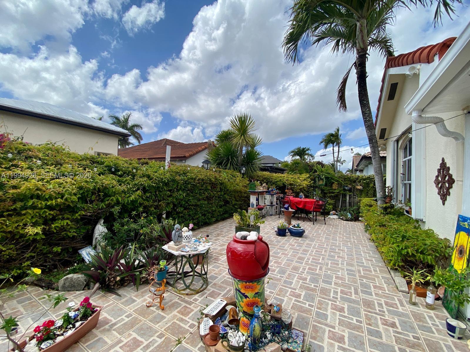 656 Northwest 129th Place Miami, FL 33182 - Photo 33 of 36 a view of street with sitting area