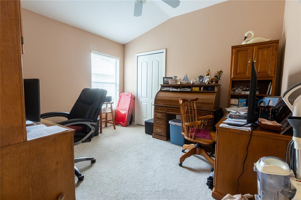 1812 Flower Branch Way Valrico, FL 33594 - Photo 25 of 42 a view of a workspace with furniture and a window