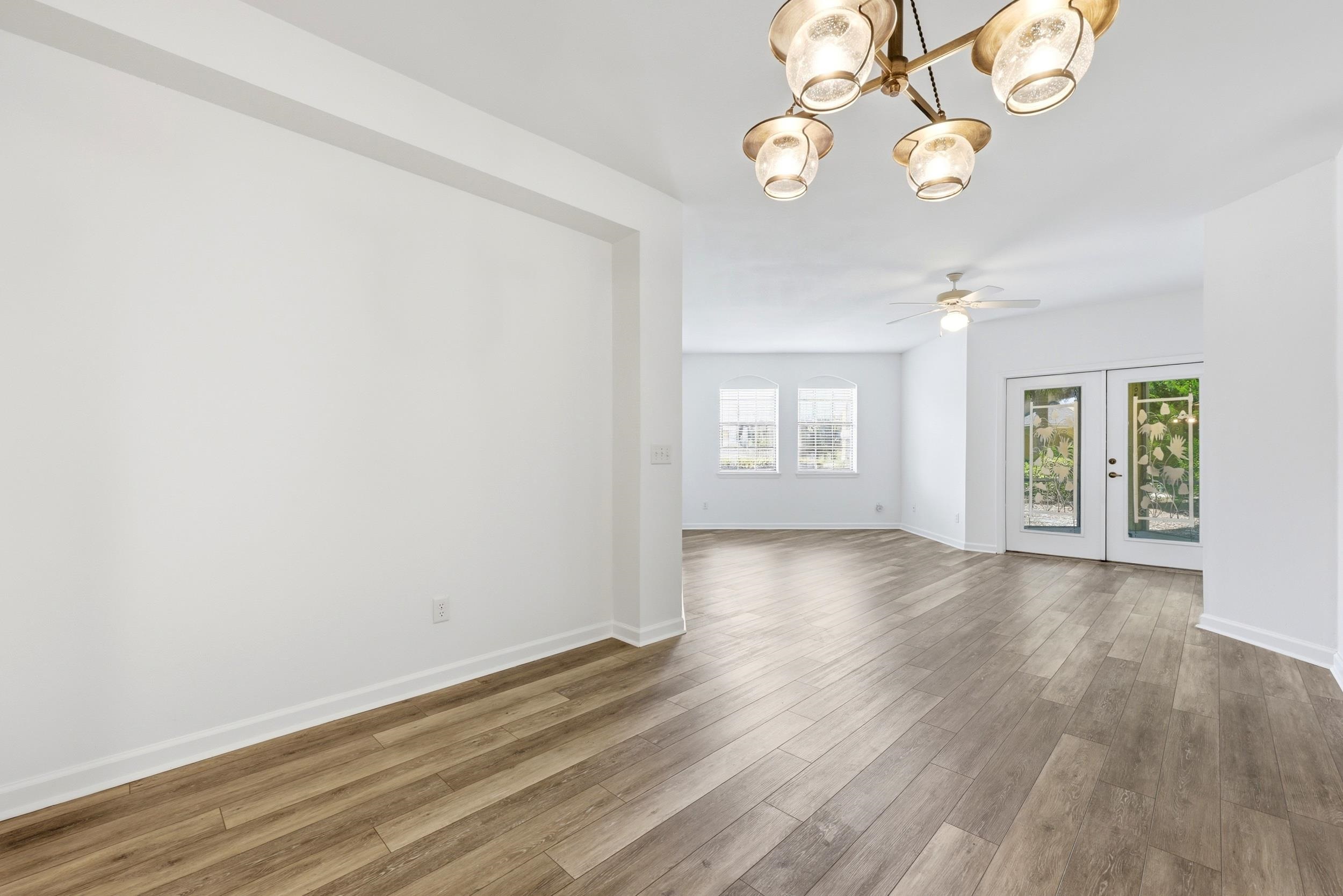 2500 Vista Cove Road St. Augustine, FL 32084 - Photo 16 of 53 an empty room with wooden floor and windows