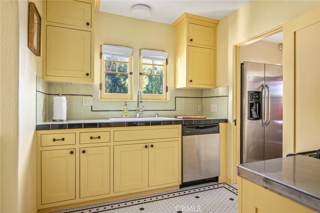 8246 4th Street Los Angeles, CA 90048 - Photo 17 of 38 a kitchen with stainless steel appliances granite countertop a refrigerator and a sink