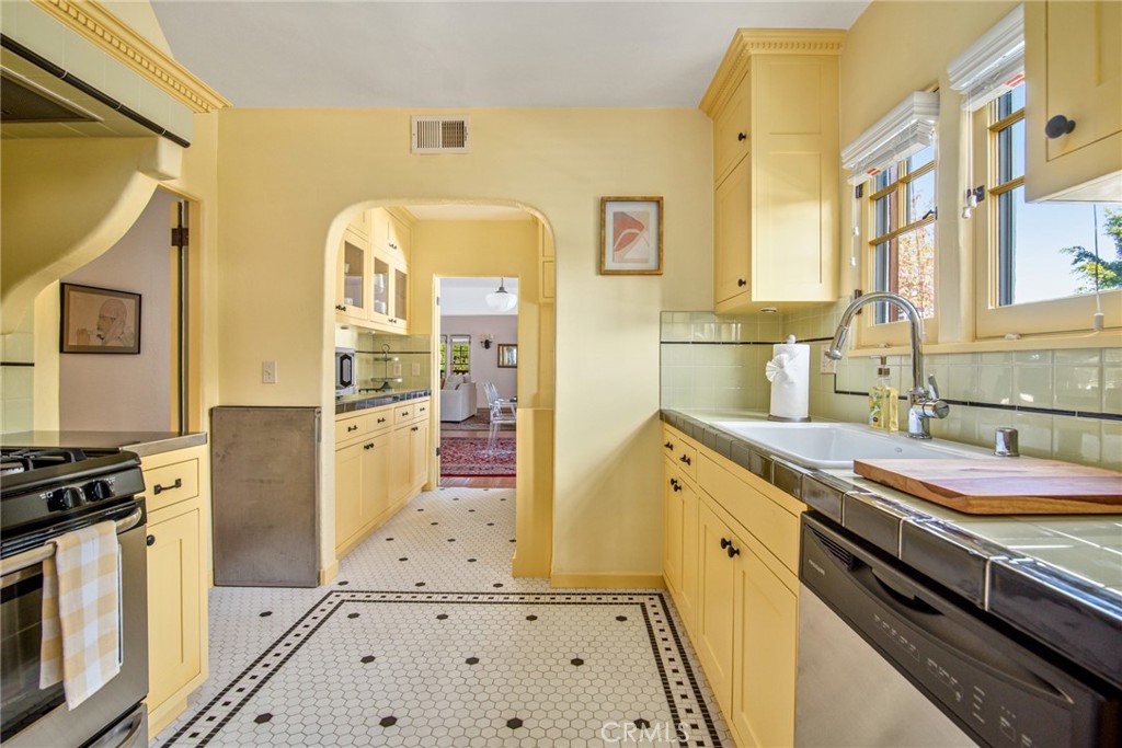 8246 4th Street Los Angeles, CA 90048 - Photo 18 of 38 a spacious bathroom with a granite countertop sink a mirror and shower