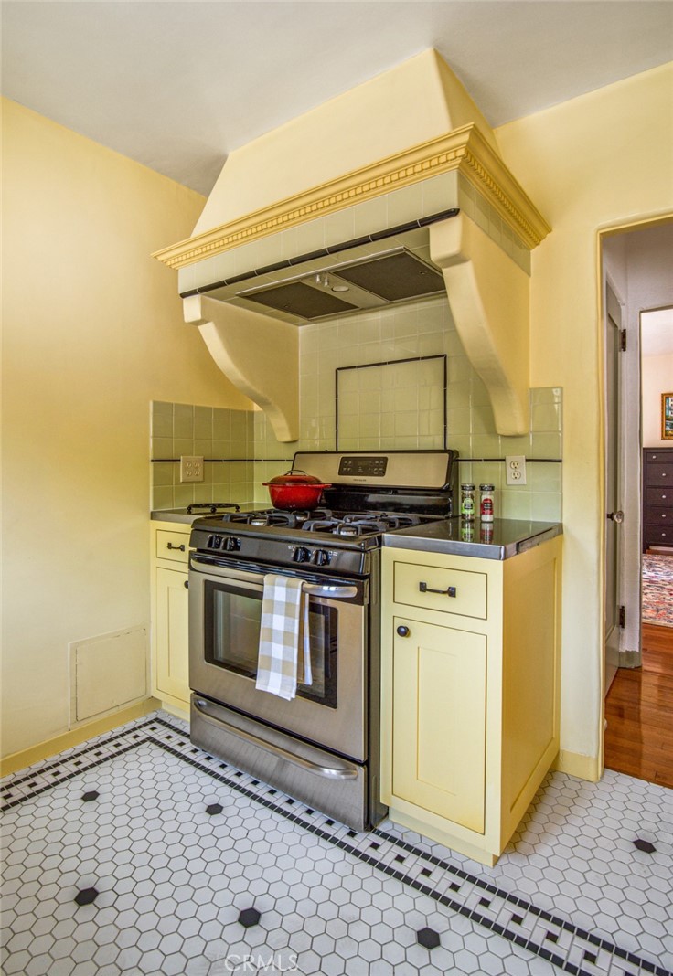 8246 4th Street Los Angeles, CA 90048 - Photo 20 of 38 a kitchen with stainless steel appliances a stove and a refrigerator