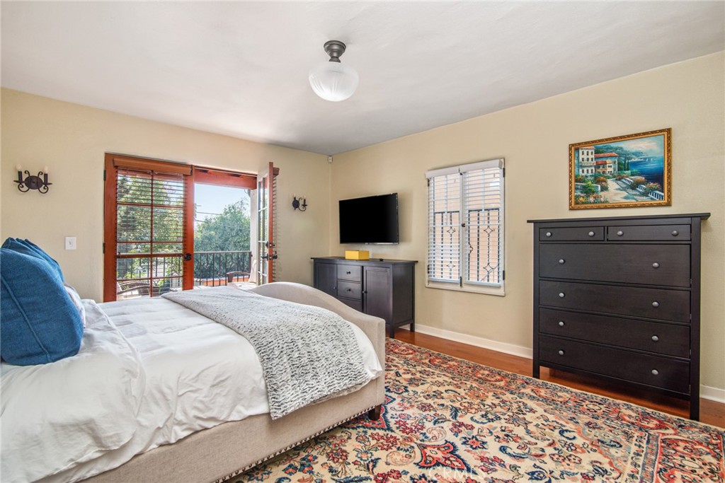 8246 4th Street Los Angeles, CA 90048 - Photo 24 of 38 a bedroom with a bed and a television