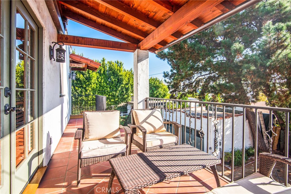 8246 4th Street Los Angeles, CA 90048 - Photo 25 of 38 a view of balcony with wooden floor and outdoor seating