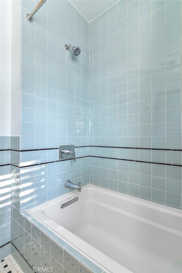 8246 4th Street Los Angeles, CA 90048 - Photo 28 of 38 a bathroom with a bathtub and shower