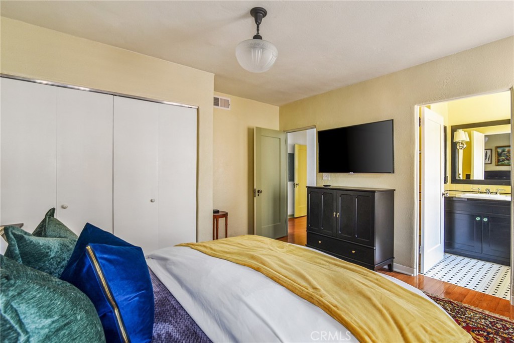 8246 4th Street Los Angeles, CA 90048 - Photo 30 of 38 a bedroom with a bed and a flat screen tv