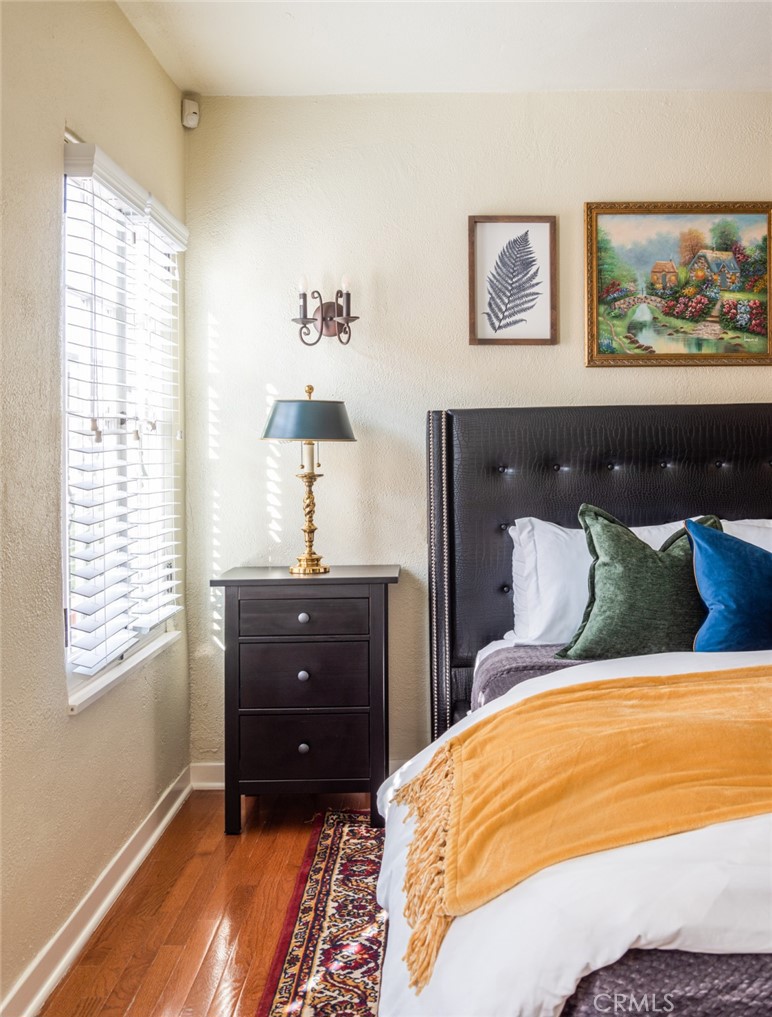 8246 4th Street Los Angeles, CA 90048 - Photo 31 of 38 a bedroom with a bed and wooden floor