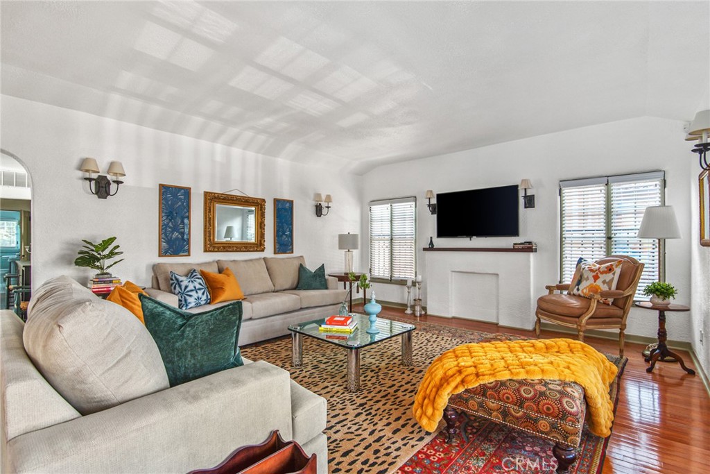 8246 4th Street Los Angeles, CA 90048 - Photo 4 of 38 a living room with furniture and a flat screen tv