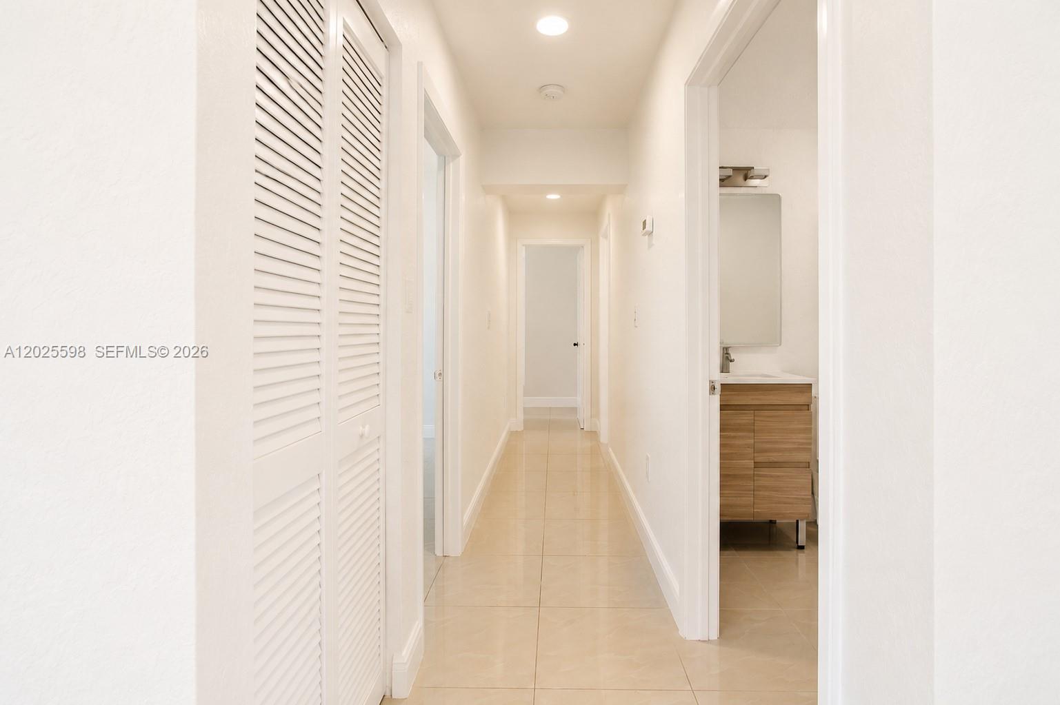 9421 Southwest 150th Street Miami, FL 33176 - Photo 16 of 31 a view of a bathroom from a hallway