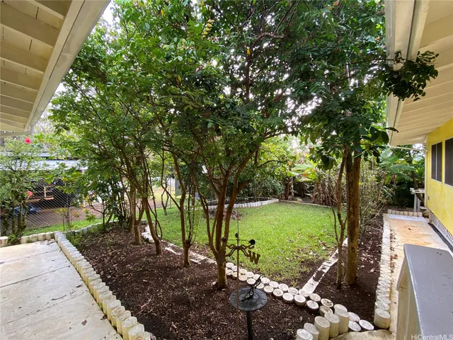 a view of backyard with green space