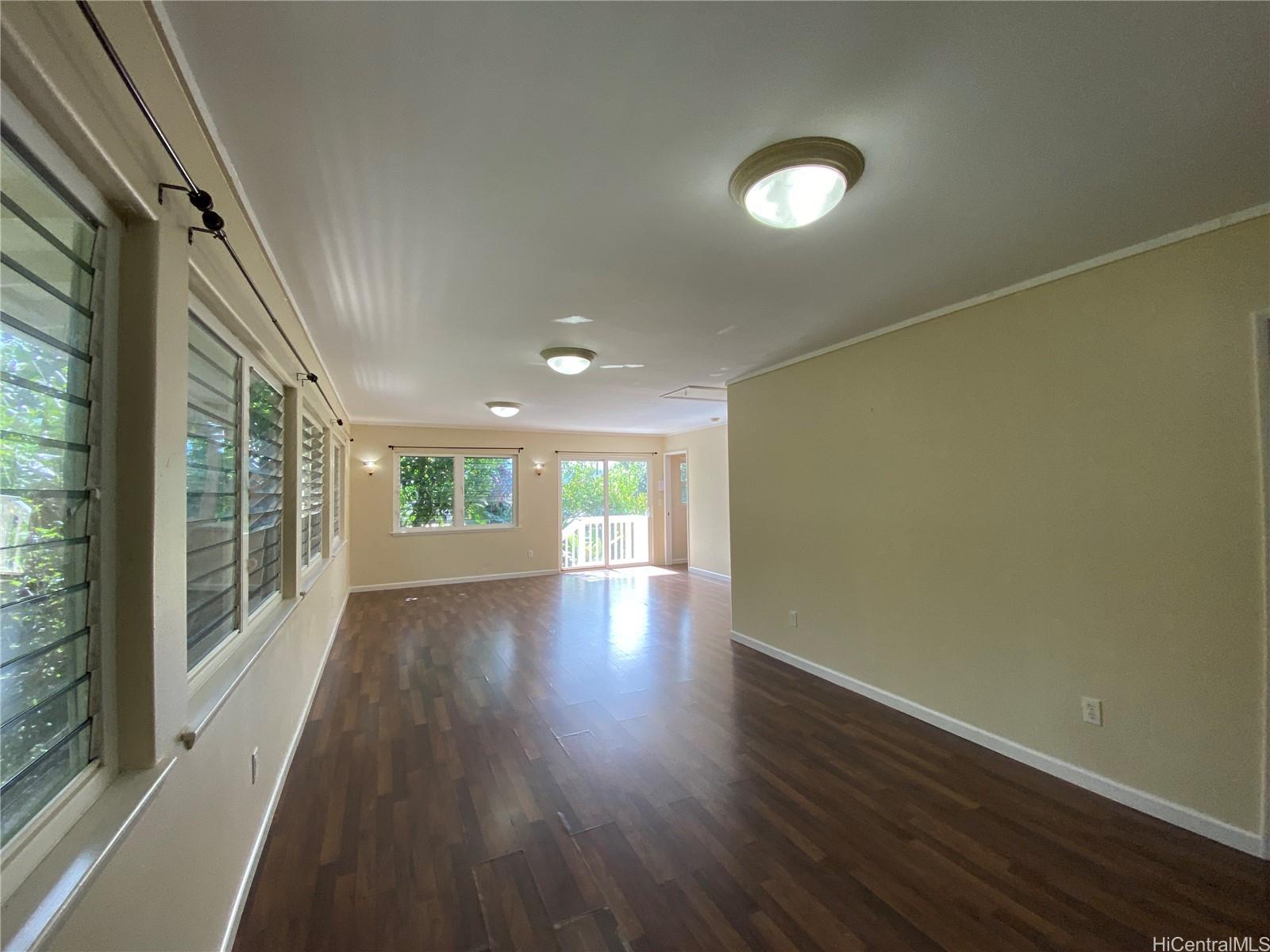 11 Haumalu Place Wahiawa, HI 96786 - Photo 3 of 15 a view of an empty room with wooden floor and a window