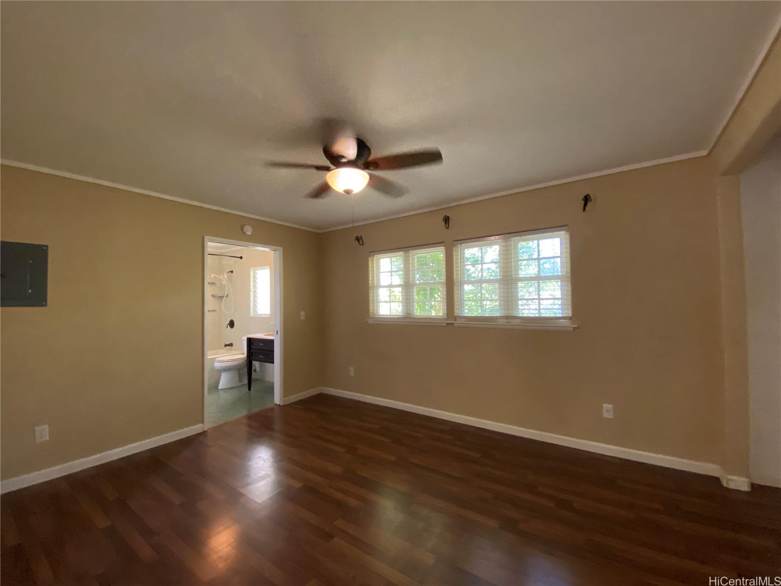 11 Haumalu Place Wahiawa, HI 96786 - Photo 5 of 15 a view of an empty room with a window and wooden floor