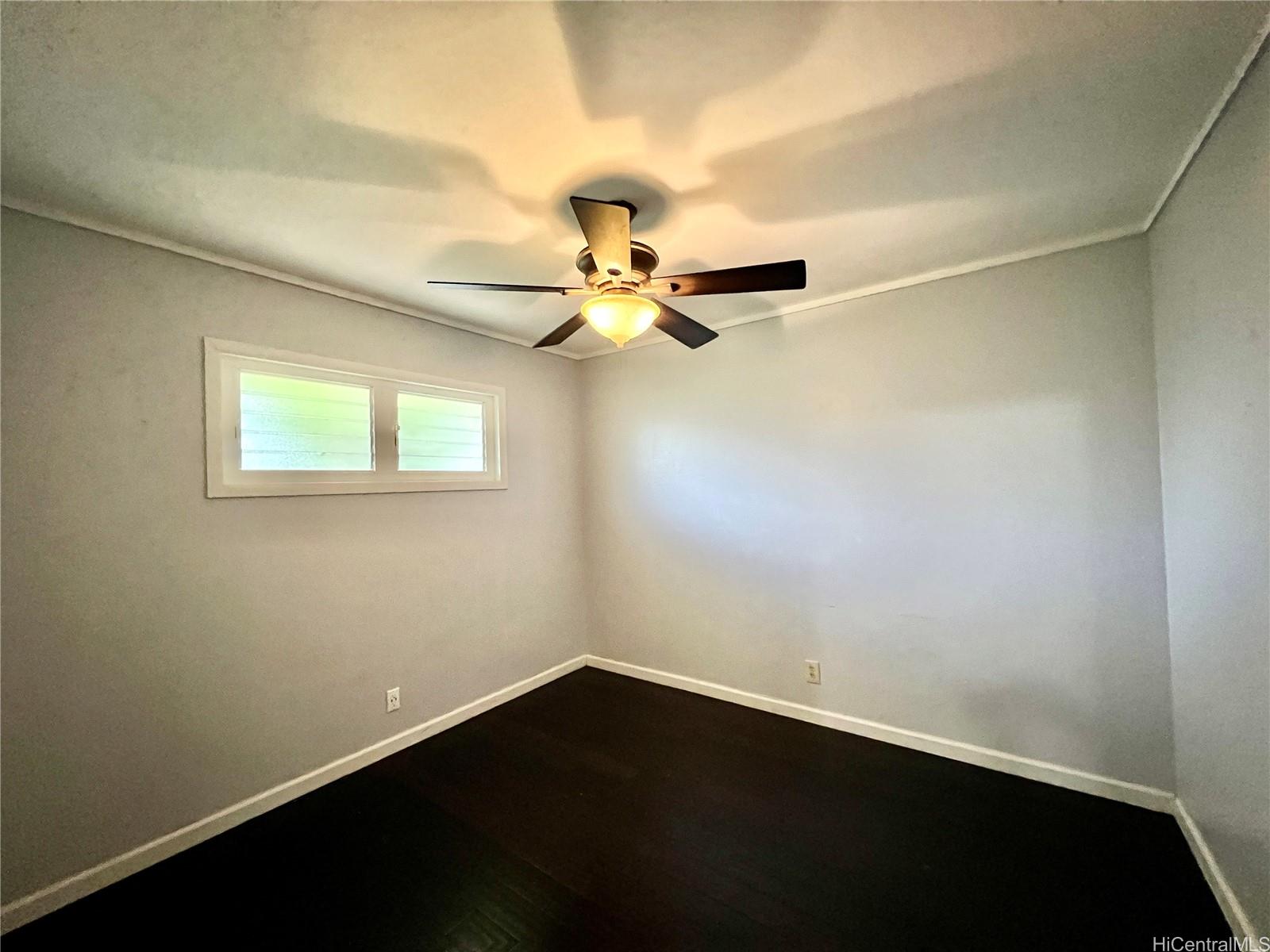 11 Haumalu Place Wahiawa, HI 96786 - Photo 7 of 15 wooden floor in an empty room with a window