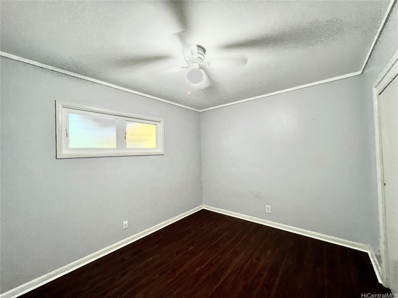 11 Haumalu Place Wahiawa, HI 96786 - Photo 9 of 15 wooden floor in an empty room with a window