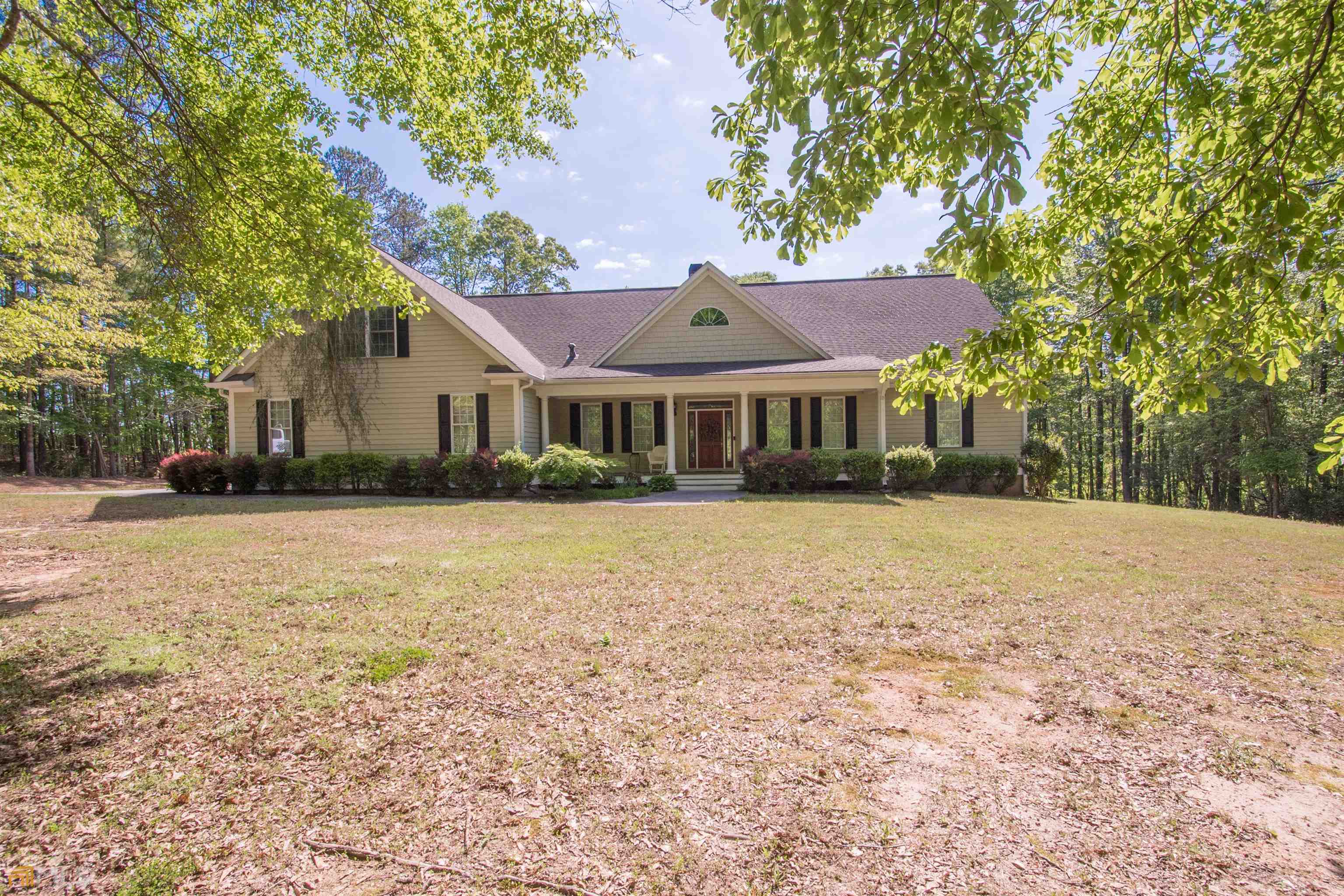 605 Tom Witcher Road Newnan, GA 30263 - Photo 1 of 1 a front view of a house with a yard