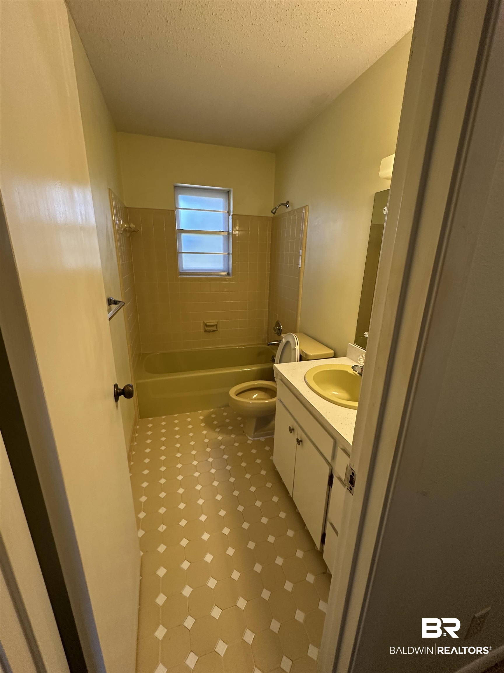 1 Yupon Circle Foley, AL 36535 - Photo 14 of 30 Bathroom with shower / bathtub combination, vanity, a textured ceiling, and light flooring