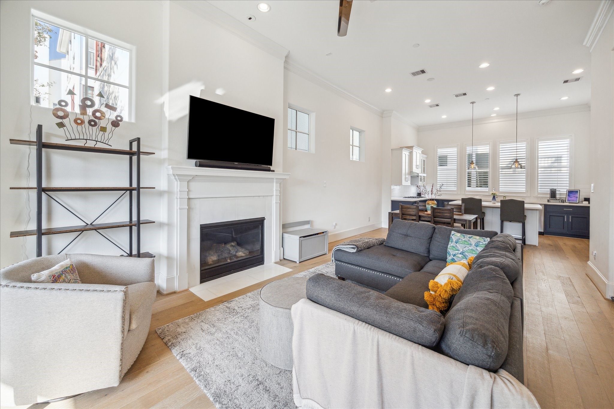 2714 Harvard Street Houston, TX 77008 - Photo 15 of 31 a living room with furniture a flat screen tv and a fireplace
