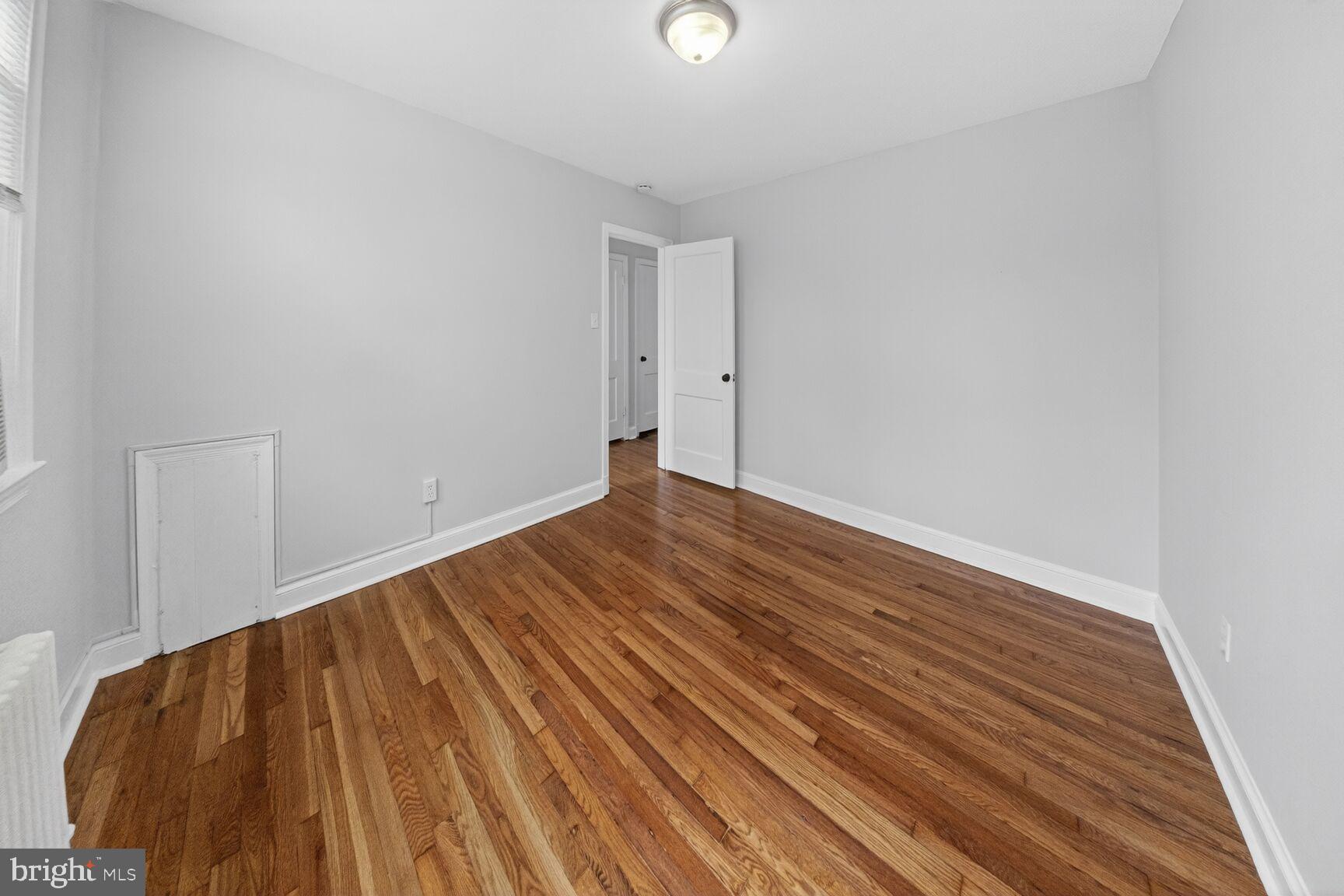 4703 Ravenswood Road, Unit 25 Riverdale, MD 20737 - Photo 12 of 12 a view of an empty room with wooden floor