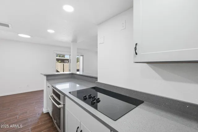 a kitchen that has a sink and a stove