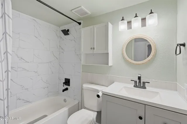 a bathroom with a sink a toilet and a bathtub