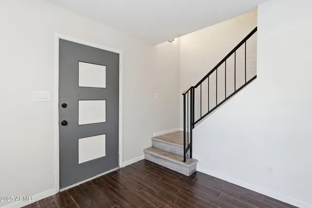 a view of entryway with wooden floor