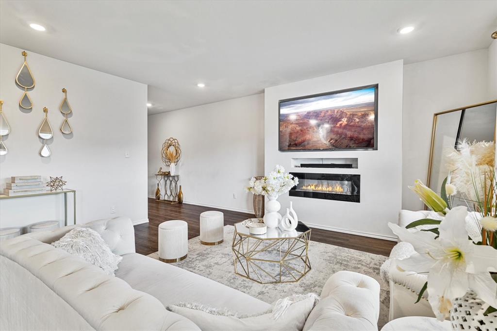 1231 Delmita Drive Forney, TX 75126 - Photo 11 of 38 a living room with furniture and a flat screen tv