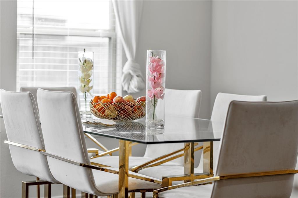 1231 Delmita Drive Forney, TX 75126 - Photo 17 of 38 a view of table and chair with wooden floor