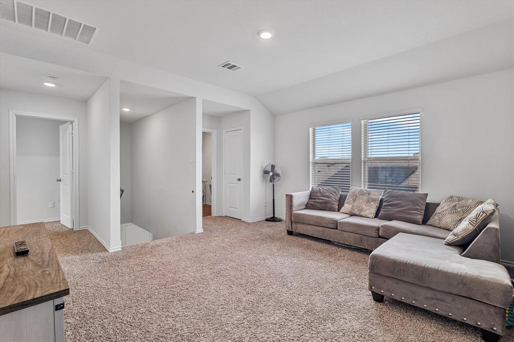 1231 Delmita Drive Forney, TX 75126 - Photo 22 of 38 a living room with furniture and a large window