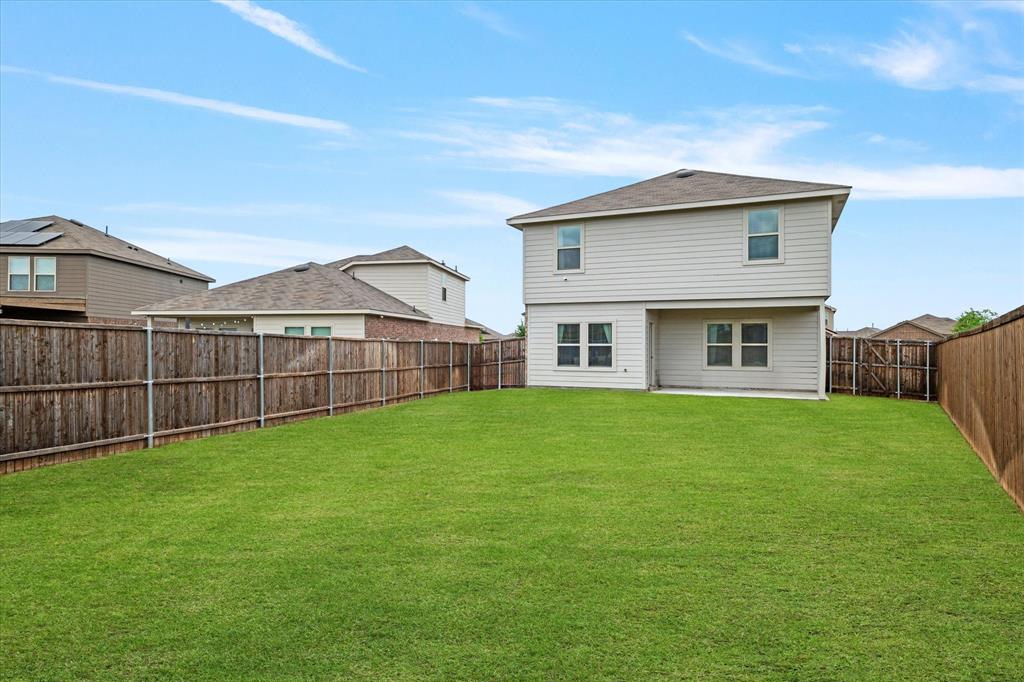 1231 Delmita Drive Forney, TX 75126 - Photo 37 of 38 a view of a house with a yard and porch