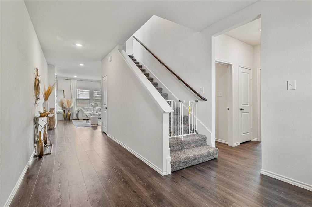 1231 Delmita Drive Forney, TX 75126 - Photo 6 of 38 a view of entryway and hall with wooden floor