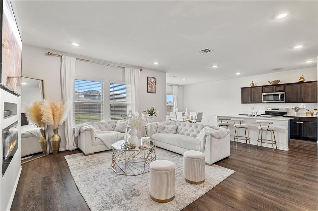 1231 Delmita Drive Forney, TX 75126 - Photo 7 of 38 a living room with furniture and view of kitchen