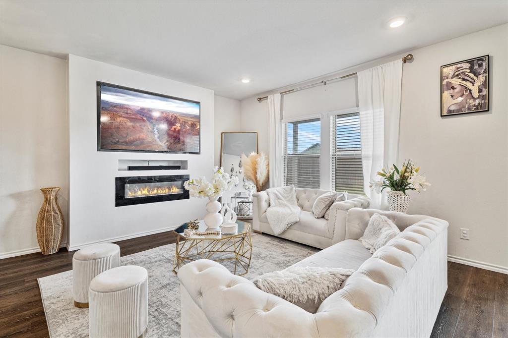 1231 Delmita Drive Forney, TX 75126 - Photo 9 of 38 a living room with furniture and a large window
