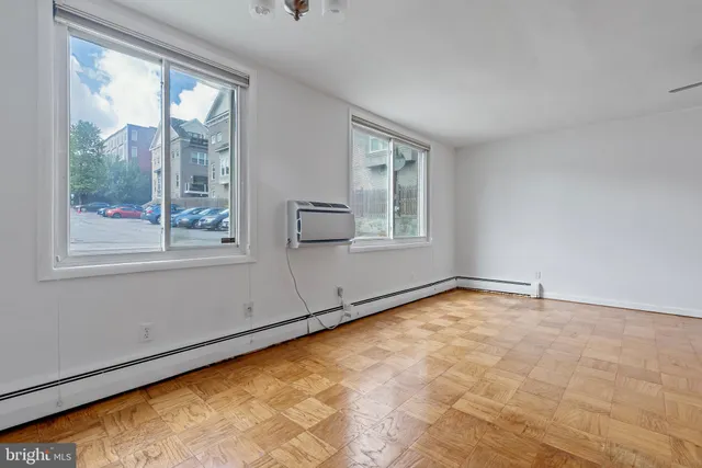 a view of an empty room with a window