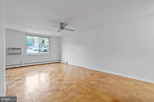 a view of an empty room with a window