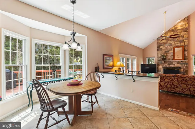 a kitchen with a table chairs and microwave