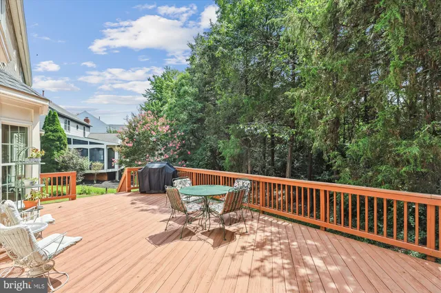 a view of balcony with wooden floor and seating space