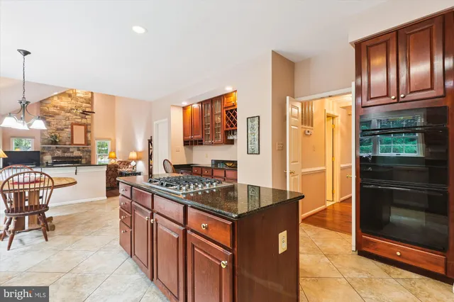 a kitchen with stainless steel appliances granite countertop a stove and a refrigerator