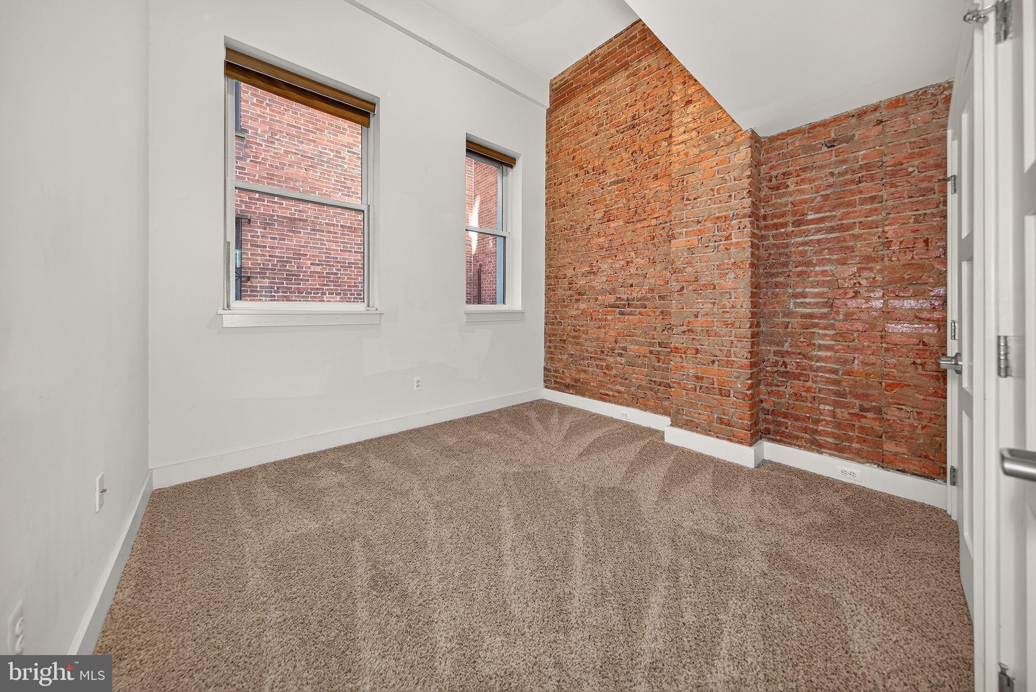 2160 California Street Northwest, Unit 101 Washington, DC 20008 - Photo 3 of 18 Bedroom - Exposed Brick