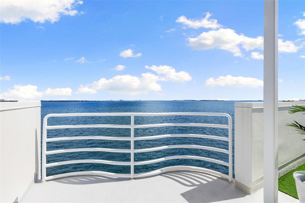 4950 Bayshore Boulevard, Unit 23 Tampa, FL 33611 - Photo 30 of 40 a view of a room with a chair and a chandelier